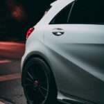 silver car on gray asphalt road during night time